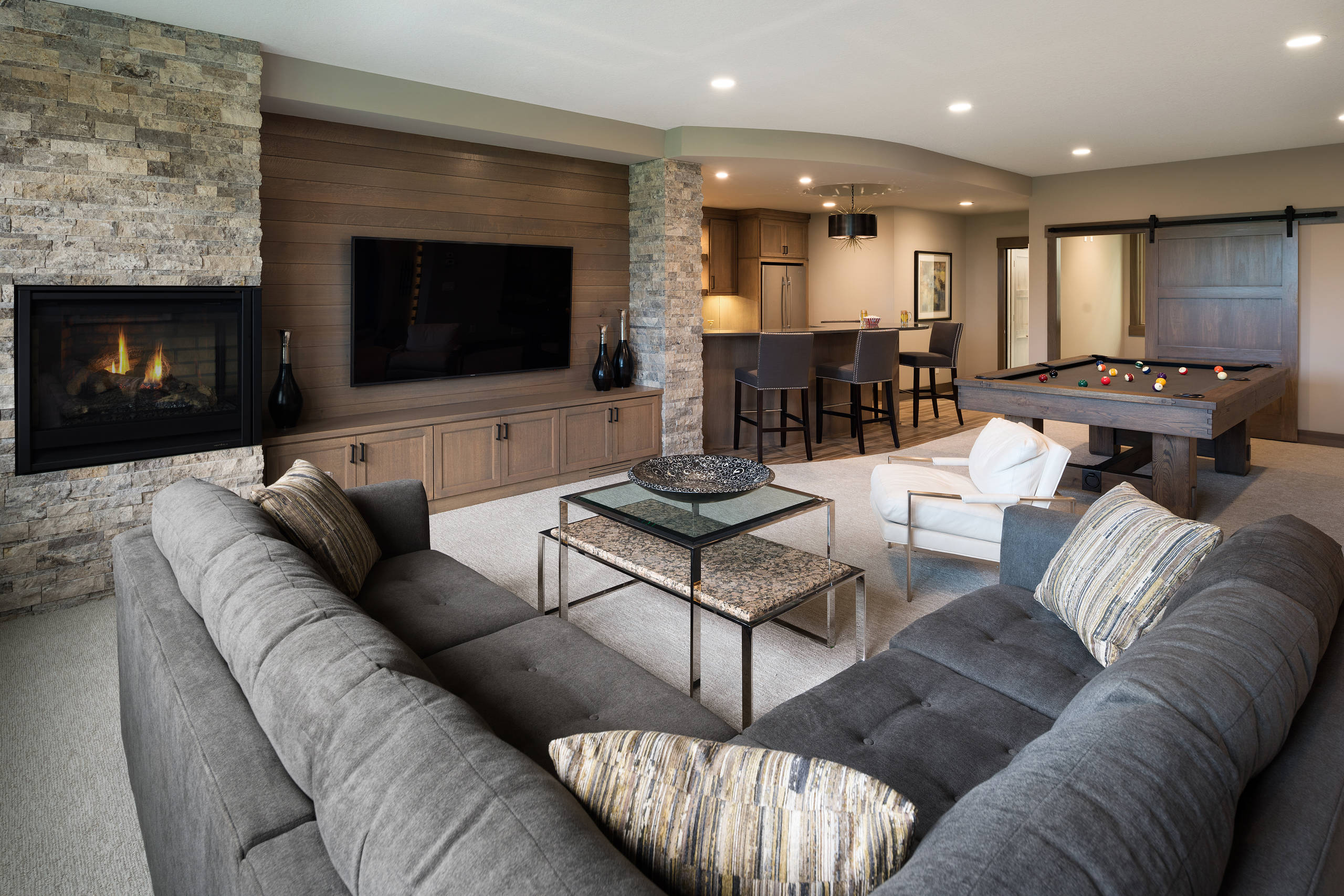 Natural Fireplace in a Plan Basement Livingroom