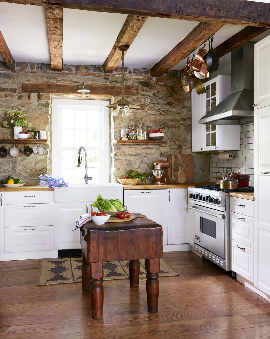 Stone Walls and Rustic Beams in White Kitchen