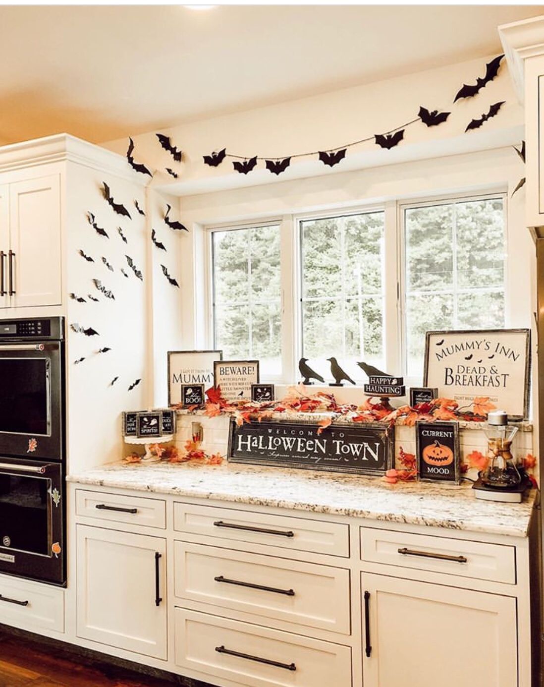 White Cabinet Setup with Halloween Decor