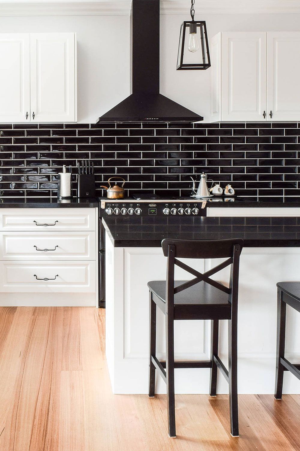 White Cabinet with Black Tiling